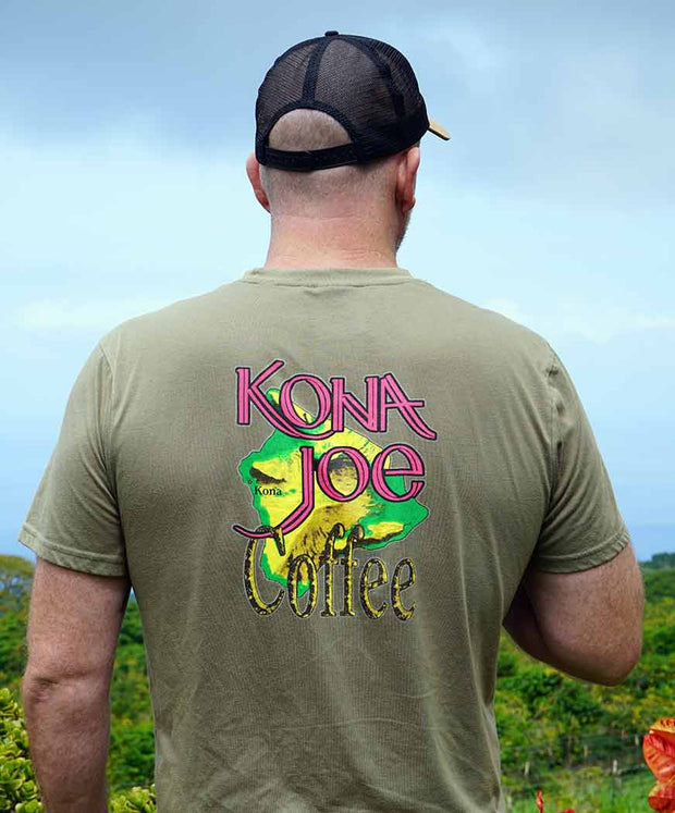 Person wearing a Kona Joe Coffee t-shirt with a coffee farm background